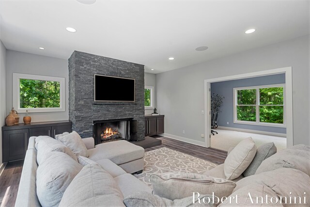 1977 Emerald Glen Ct NE, Ada, MI 49301 - living area featuring healthy amount of natural light, wood finished floors, and recessed lighting