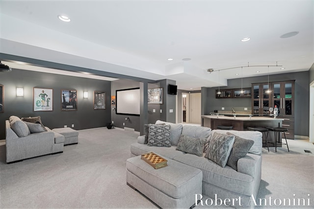 1977 Emerald Glen Ct NE, Ada, MI 49301 - living area featuring light colored carpet, recessed lighting, and bar