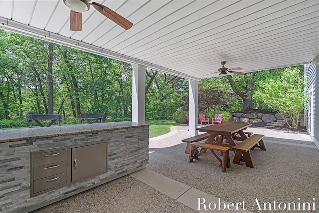 1977 Emerald Glen Ct NE, Ada, MI 49301 - view of patio featuring ceiling fan and outdoor dining space