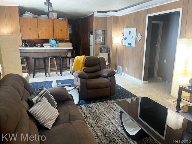 103 N Roselawn St, Pontiac, MI 48342 - living area with wooden walls and light tile patterned floors