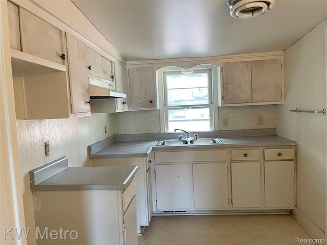 103 N Roselawn St, Pontiac, MI 48342 - kitchen featuring under cabinet range hood, light tile patterned flooring, and light countertops