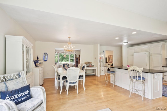 2550 Ives Rd, Tecumseh, MI 49286 - dining space with a chandelier, light wood-style floors, and recessed lighting