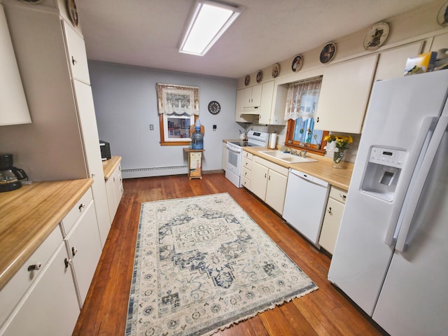135 Teal Dr, Coldwater, MI 49036 - kitchen featuring white appliances, a baseboard radiator, light countertops, white cabinetry, and dark wood-style flooring