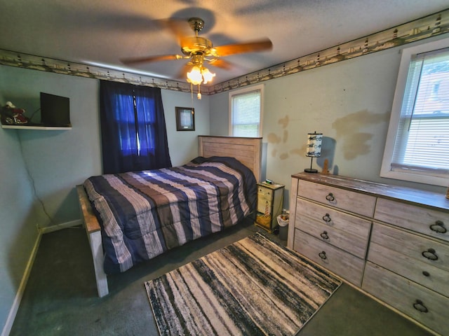 135 Teal Dr, Coldwater, MI 49036 - carpeted bedroom featuring multiple windows and ceiling fan