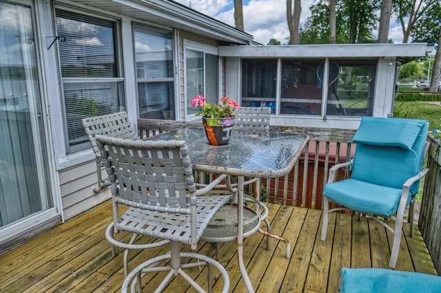 135 Teal Dr, Coldwater, MI 49036 - wooden deck with a sunroom and outdoor dining area
