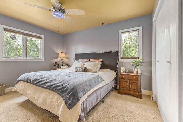 9749 48th Ave, Allendale, MI 49401 - bedroom with carpet, multiple windows, and ceiling fan