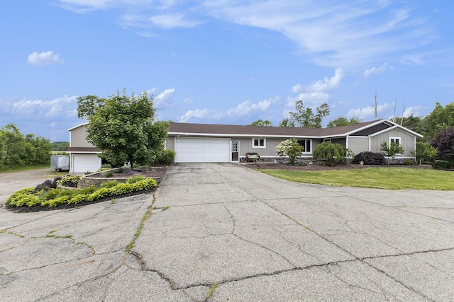 9749 48th Ave, Allendale, MI 49401 - view of front of house with driveway, an attached garage, and a front yard