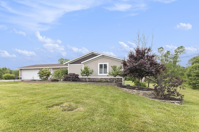 9749 48th Ave, Allendale, MI 49401 - view of front facade with a front lawn and an attached garage