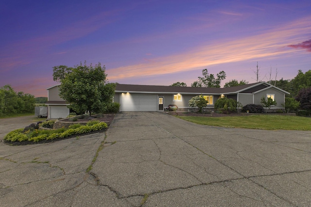 9749 48th Ave, Allendale, MI 49401 - view of front of property featuring a garage, driveway, and a front yard
