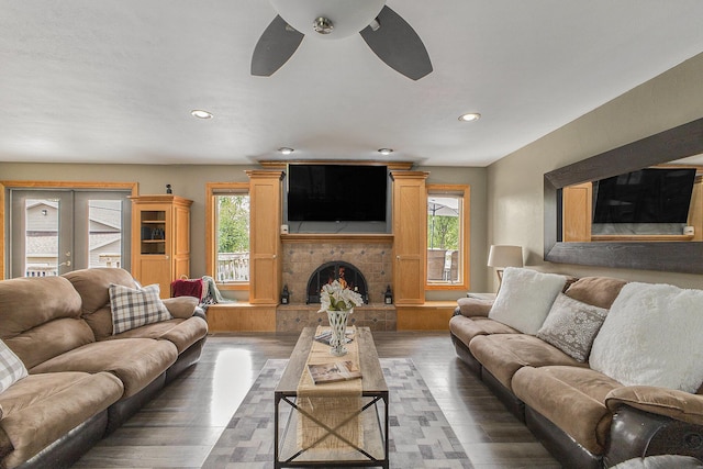 9749 48th Ave, Allendale, MI 49401 - living area with healthy amount of natural light, ceiling fan, a fireplace with raised hearth, recessed lighting, and wood finished floors