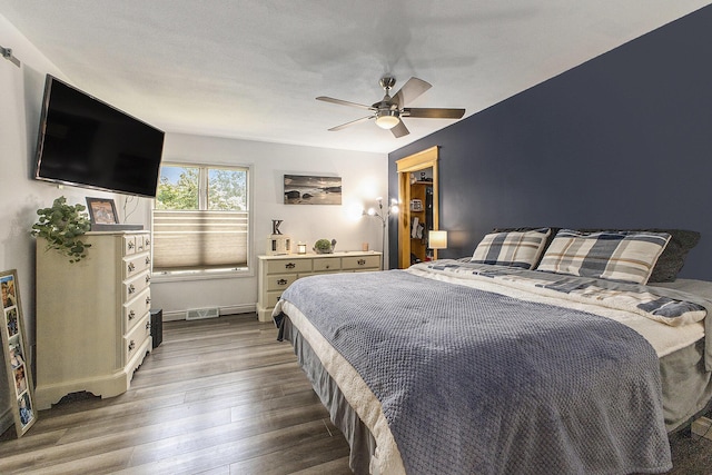 9749 48th Ave, Allendale, MI 49401 - bedroom featuring wood finished floors and a ceiling fan