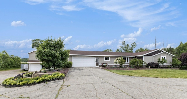 9749 48th Ave, Allendale, MI 49401 - view of front of house with driveway, an attached garage, and a front yard