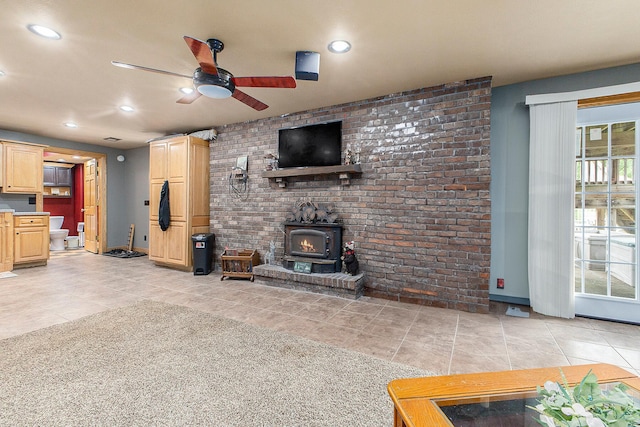 9749 48th Ave, Allendale, MI 49401 - unfurnished living room featuring a wood stove, ceiling fan, light tile patterned flooring, and recessed lighting