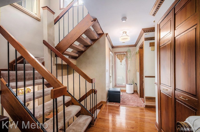 6271 Potomac Cir W, Bloomfield, MI 48322 - foyer entrance with light wood-type flooring, ornamental molding, and stairs