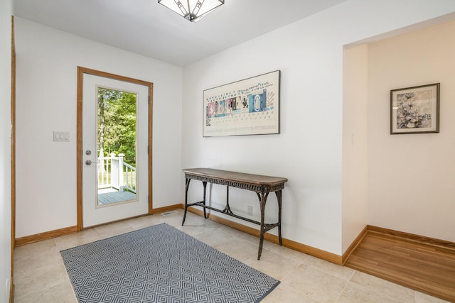 6368 E Lake Ln, Sawyer, MI 49125 - entrance foyer featuring light tile patterned floors and baseboards