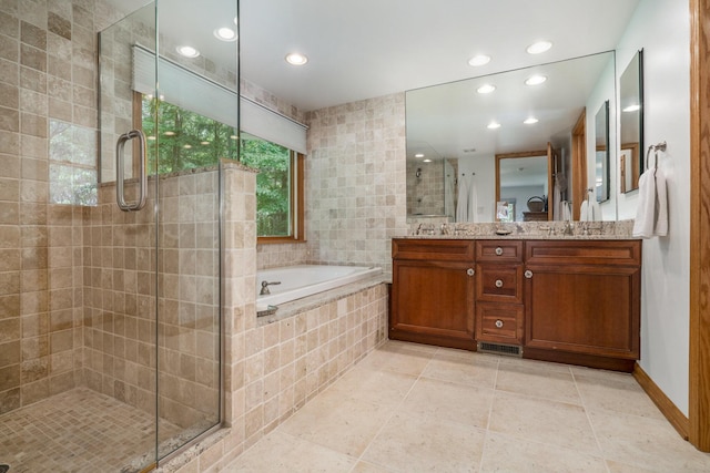 6368 E Lake Ln, Sawyer, MI 49125 - bathroom featuring a stall shower, a bath, double vanity, recessed lighting, and tile patterned floors