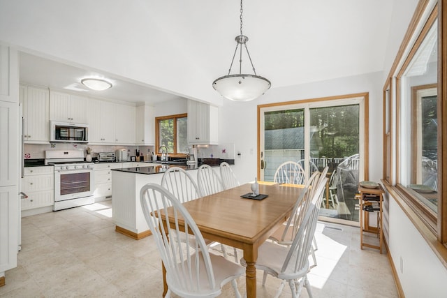 6368 E Lake Ln, Sawyer, MI 49125 - dining room with a towering ceiling and baseboards