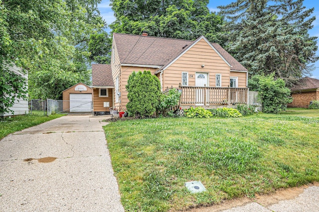 134 Honeoye St SW, Grand Rapids, MI 49548 - bungalow featuring driveway, roof with shingles, a garage, and an outdoor structure