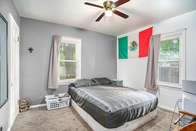 134 Honeoye St SW, Grand Rapids, MI 49548 - bedroom featuring carpet flooring, multiple windows, and ceiling fan