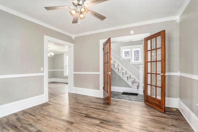 436 Quimby St NE, Grand Rapids, MI 49505 - empty room with french doors, wood finished floors, stairway, crown molding, and a ceiling fan