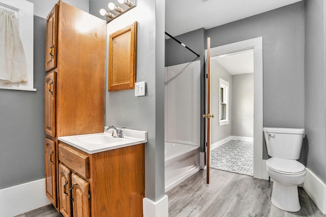 436 Quimby St NE, Grand Rapids, MI 49505 - full bathroom with vanity, wood finished floors, and  shower combination