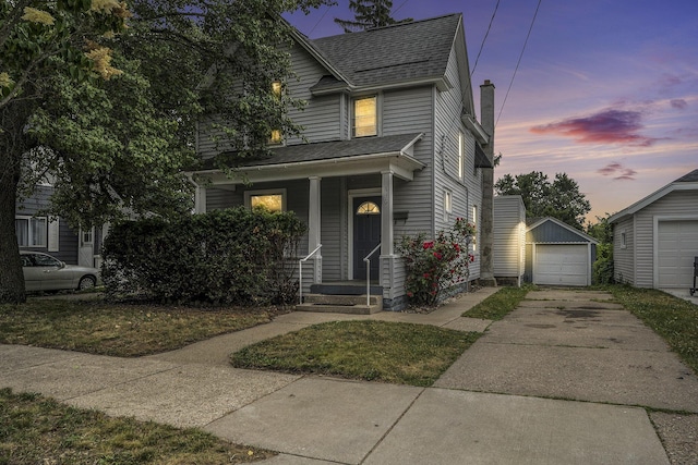 436 Quimby St NE, Grand Rapids, MI 49505 - view of front of house with driveway, a shingled roof, an outdoor structure, a chimney, and a detached garage