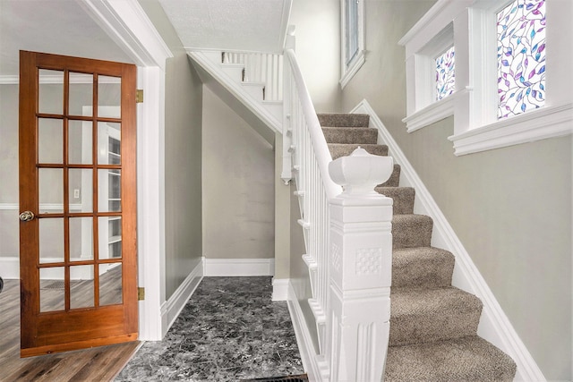 436 Quimby St NE, Grand Rapids, MI 49505 - stairs featuring baseboards