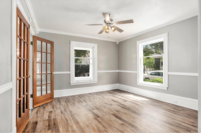 436 Quimby St NE, Grand Rapids, MI 49505 - unfurnished room with wood finished floors, ornamental molding, and a ceiling fan