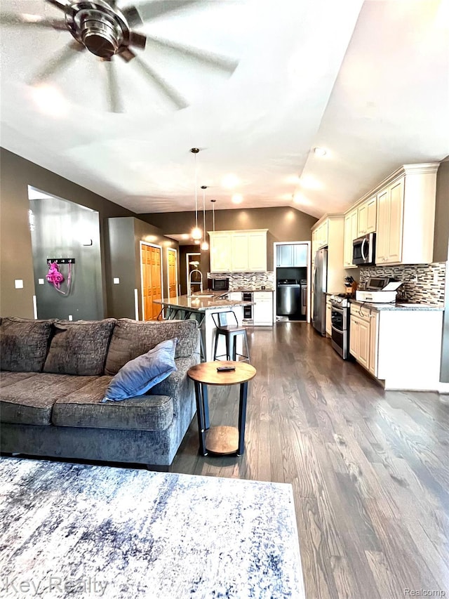 7949 Church Rd, Grosse Ile, MI 48138 - living room with a ceiling fan, dark wood finished floors, and vaulted ceiling