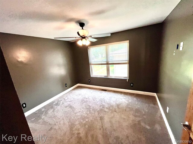 7949 Church Rd, Grosse Ile, MI 48138 - empty room with carpet flooring and ceiling fan