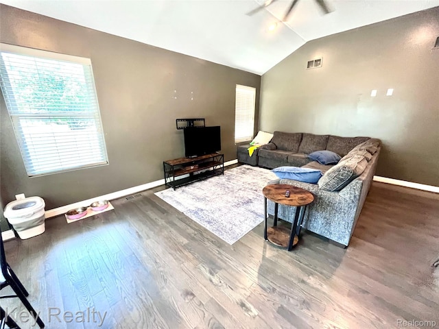7949 Church Rd, Grosse Ile, MI 48138 - living room with vaulted ceiling, healthy amount of natural light, wood finished floors, and a ceiling fan
