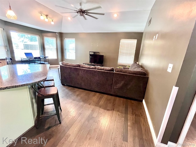 7949 Church Rd, Grosse Ile, MI 48138 - living area with wood finished floors, ceiling fan, and lofted ceiling