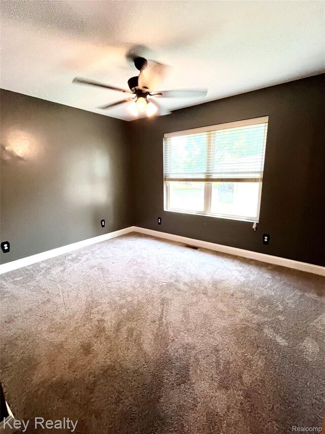 7949 Church Rd, Grosse Ile, MI 48138 - spare room with ceiling fan and carpet flooring