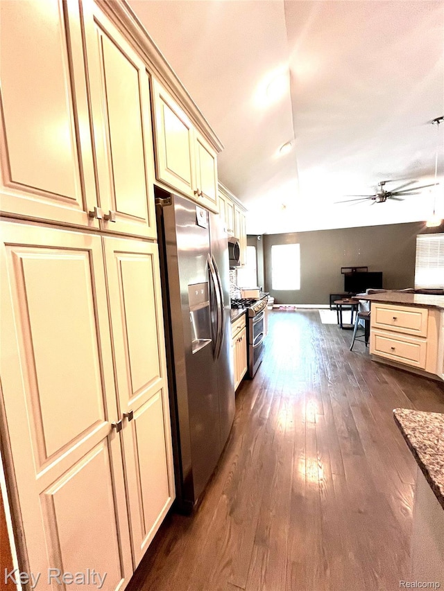 7949 Church Rd, Grosse Ile, MI 48138 - kitchen with appliances with stainless steel finishes, cream cabinets, open floor plan, a ceiling fan, and dark wood-style flooring