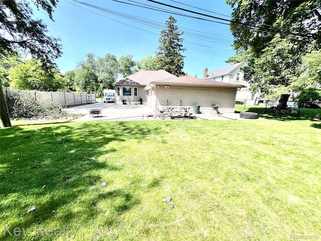 7949 Church Rd, Grosse Ile, MI 48138 - back of property with a patio, a fenced backyard, and a fire pit