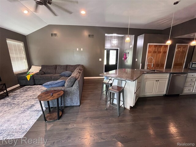 7949 Church Rd, Grosse Ile, MI 48138 - living area featuring ceiling fan, vaulted ceiling, dark wood-style floors, and recessed lighting
