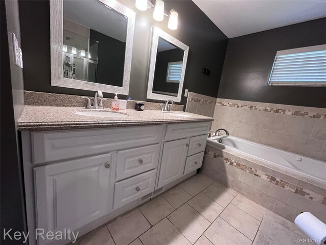 7949 Church Rd, Grosse Ile, MI 48138 - full bathroom featuring double vanity, tile patterned floors, and a bath