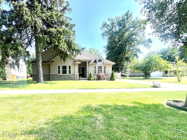 7949 Church Rd, Grosse Ile, MI 48138 - view of front facade with stone siding and a front yard