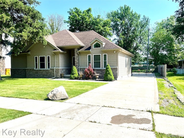7949 Church Rd, Grosse Ile, MI 48138 - craftsman inspired home with concrete driveway, a shingled roof, and a gate
