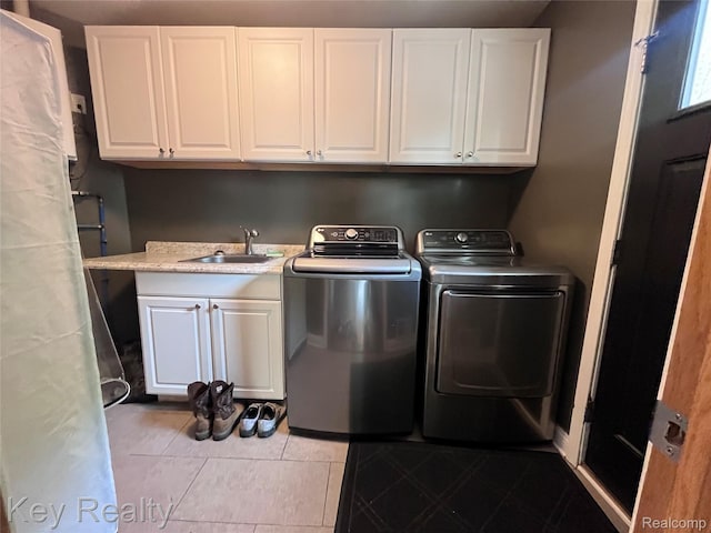 7949 Church Rd, Grosse Ile, MI 48138 - washroom featuring washer and dryer, cabinet space, and light tile patterned floors