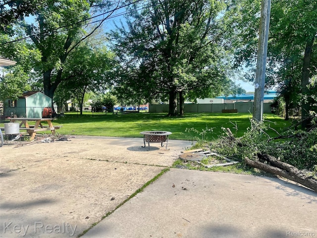 7949 Church Rd, Grosse Ile, MI 48138 - surrounding community featuring an outdoor fire pit and a patio