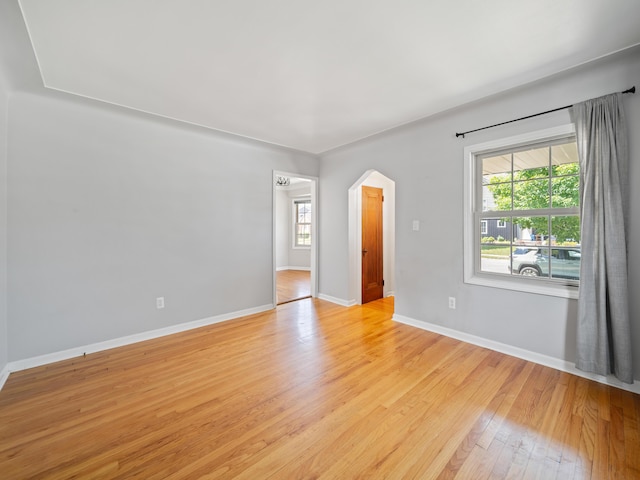 2391 Cambridge Rd, Berkley, MI 48072 - unfurnished room featuring light wood-style flooring, plenty of natural light, and arched walkways