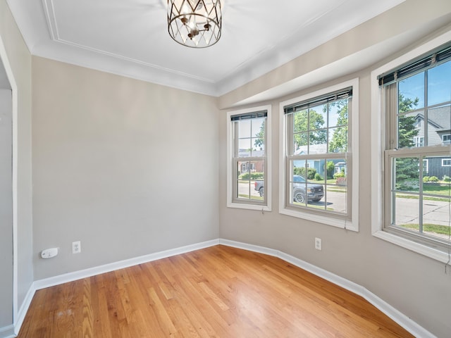 2391 Cambridge Rd, Berkley, MI 48072 - unfurnished room with a chandelier and light wood finished floors