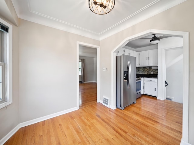 2391 Cambridge Rd, Berkley, MI 48072 - kitchen featuring appliances with stainless steel finishes, dark countertops, light wood-style floors, white cabinets, and backsplash