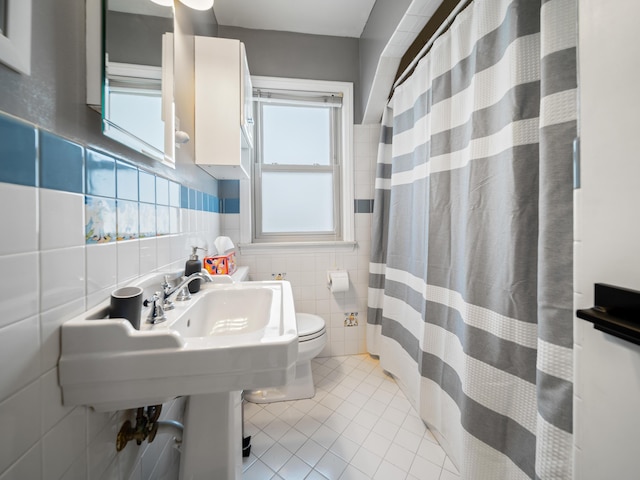 2391 Cambridge Rd, Berkley, MI 48072 - bathroom with tile walls, tile patterned floors, and a shower with curtain