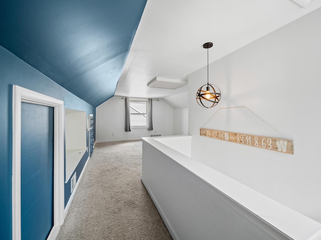 2391 Cambridge Rd, Berkley, MI 48072 - hallway with light colored carpet, vaulted ceiling, and an upstairs landing