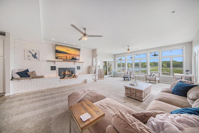 828 Russmiller Loop, Brooklyn, MI 49230 - living area featuring a brick fireplace, a ceiling fan, carpet floors, recessed lighting, and brick wall
