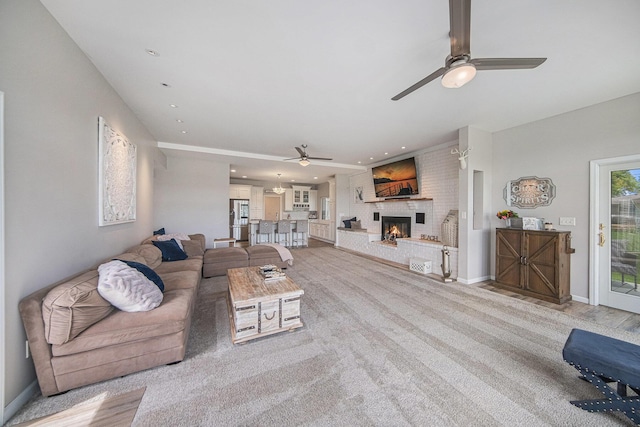 828 Russmiller Loop, Brooklyn, MI 49230 - living area featuring a ceiling fan, a fireplace, recessed lighting, and light carpet