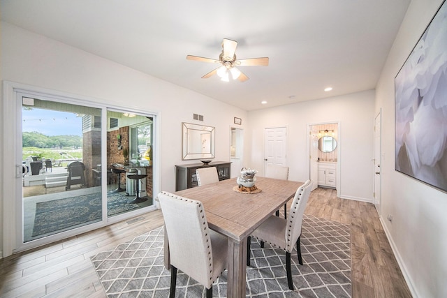 828 Russmiller Loop, Brooklyn, MI 49230 - dining room with light wood-type flooring, a ceiling fan, and recessed lighting