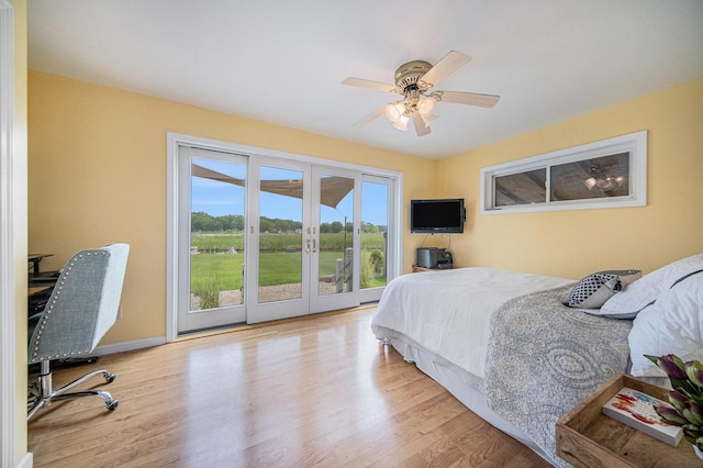 828 Russmiller Loop, Brooklyn, MI 49230 - bedroom featuring access to outside, french doors, wood finished floors, and a ceiling fan
